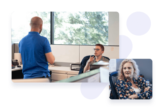 Two colleagues talking at a desk, with a portrait of a third laid over the corner as a collage