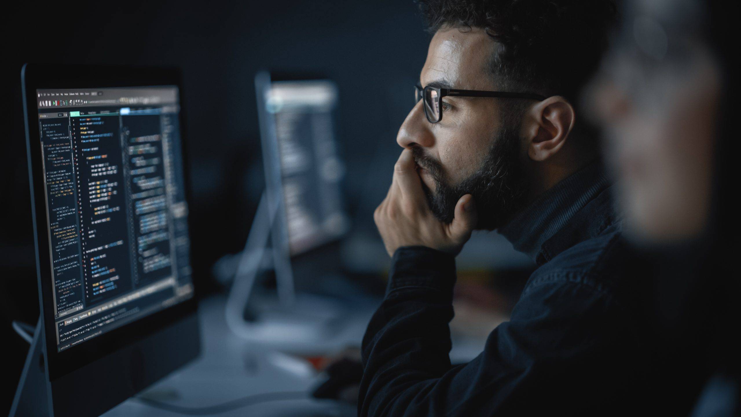 Male Student, Studying in University with Diverse Multiethnic Classmates. He Works on Desktop Computer in College. Applying His Knowledge in Writing Code, Developing Software