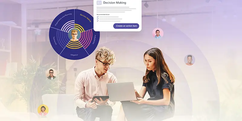 Two colleagues sit together, working on laptops and tablets. Around them are digital profile icons and data visualizations, highlighting team collaboration, sharing of information, and effective coaching in a modern office setting.