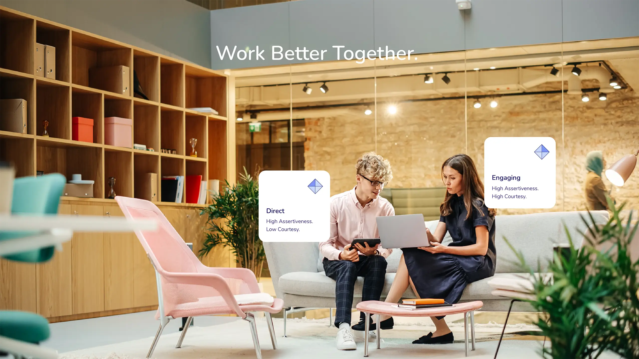 Work better together. Two colleagues sit with a laptop in a bright office, with cards beside them reading Direct: high assertiveness, low courtesy, and Engaging: high assertiveness, high courtesy.