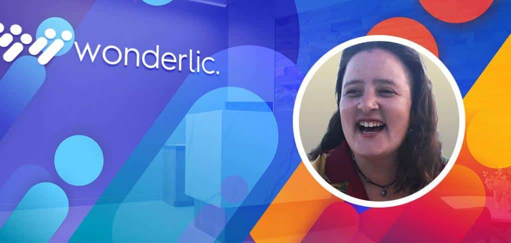 Colorful banner featuring the Wonderlic logo on the left with abstract shapes. On the right, there's a circular photo of a smiling person.
