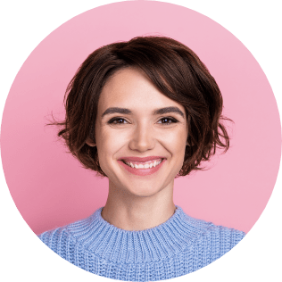 A woman with short brown hair is smiling at the camera in a light blue sweater against a pink background. Get started with a Wonderlic demo to see why she's so confident.