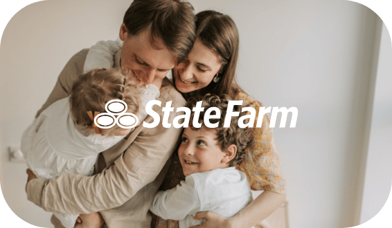 A happy family embraces each other, consisting of a man, a woman, a young boy, and a toddler. The State Farm logo with three interlocking ovals and the text "State Farm" is displayed prominently over the softly blurred background. Discover career opportunities by taking our Hiring Assessment.